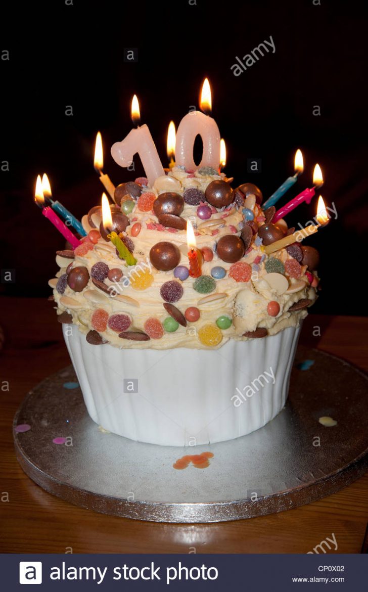 70Th Birthday Cake 70th Birthday Cake With Lighted Candles And Decorated With Sweets 70Th Birthday Cake 70th Birthday Cake With Lighted Candles And Decorated With Sweets