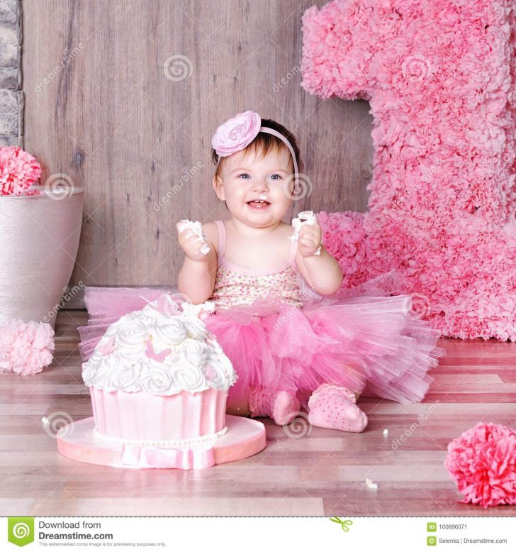 Baby Girl Birthday Cake 1 Year Ba Girl In Pink Dress With Her First Birthday Cake Stock Baby Girl Birthday Cake 1 Year Ba Girl In Pink Dress With Her First Birthday Cake Stock